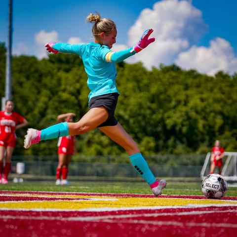 Ladycat goalkeeper Aubrey Record displays her powerful kicking style as she gets set to send the ball into play. Photo by Pete Wigginton.