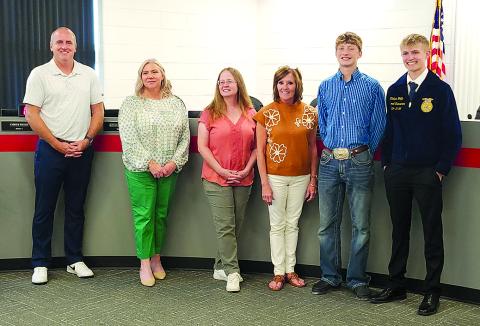 At its Sept. 15 meeting, the Pendleton County School Board honored its FFA students’ achievements at the Kentucky State Fair. From left are board members Kevin Barnard, Amber Beebe, Laura Schack and Cheri Griffin, and FFA members TJ Weinel and Klaber Wolfe. Photo by Burton Cole.