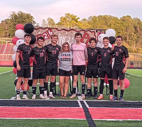 The Wildcats soccer program honored its seven seniors following a home win over Covington Latin on September 16. Pictured from L-R:  Dawson Nichols, Clark Cummins, Alex Mosley, head coach Amber Nichols, Adam Beebe, Patrick Patton, Jacob Frisch and Mason Ammerman. Photo by Sam McClanahan.