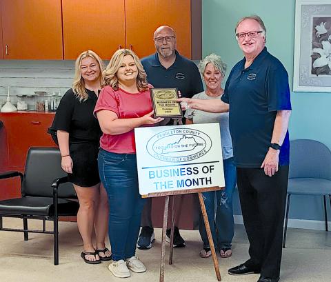 Pictured from left are spa employee Angel Winkle, salon owner Lisa Wiggins, Chamber member Randy Wells, Pendleton County Director of Economic and Tourism Development Tami Vater and Chamber President Neil Belcher.