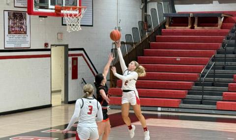 Ladycats senior Lilly Ashcraft rises over her defender for a layup during the teams home win over Raceland. Photo provided by Alicia Teegarden.