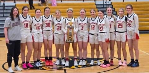The Ladycats pose with their championship trophy following a 57-49 victory over Lloyd Memorial in the finals of the Pam Browning Classic.