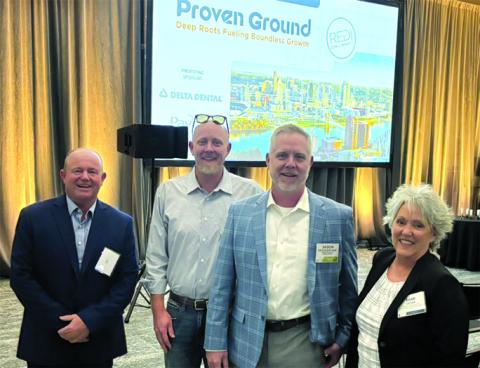 Rick Mineer, Pendleton County Fiscal Court Magistrate Rick Mineer, left, Paragon co-owners Bryan and Jason Meuhlenkamp, and Tami Vater, Pendleton County Economic and Tourism Development director, celebrate Paragon’s recognition.