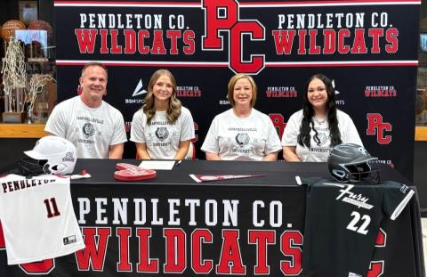 Pendleton County senior Mylie Honnert, pictured second from left, signed with Campbellsville University on March 7 to continue her academic and athletic pusuits in Fastpitch Softball. She's shown above with her parents Jeremy and Michelle, along with her sister Isabelle. Photo courtesy of Jon Wirth. 