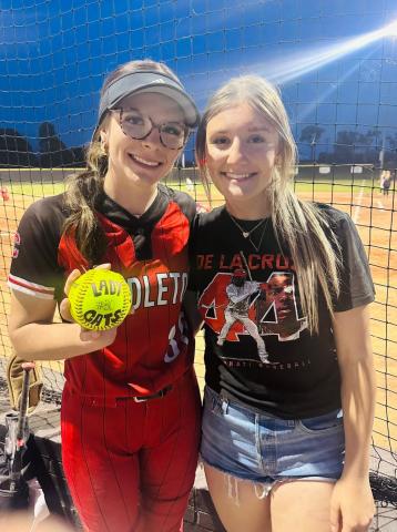 Ladycats ace pitcher Hannah Spaulding, left, poses with her younger sister Hadley after striking out a new career-high 16 hitters versus Woodford County.