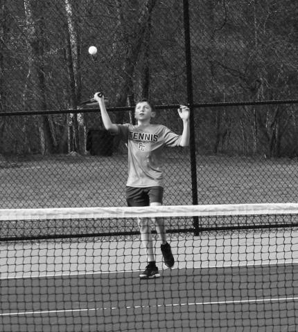 Seventh grader Leo Maddy, one of the promising young members of the tennis program, has had a strong start to his season. Photo by Sam McClanahan. 