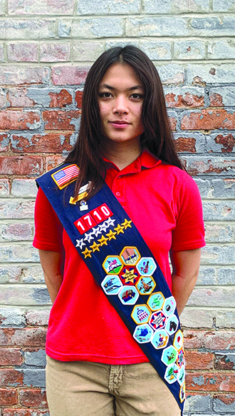 Crawford also has a sash full of badges as part of American Heritage Girls.