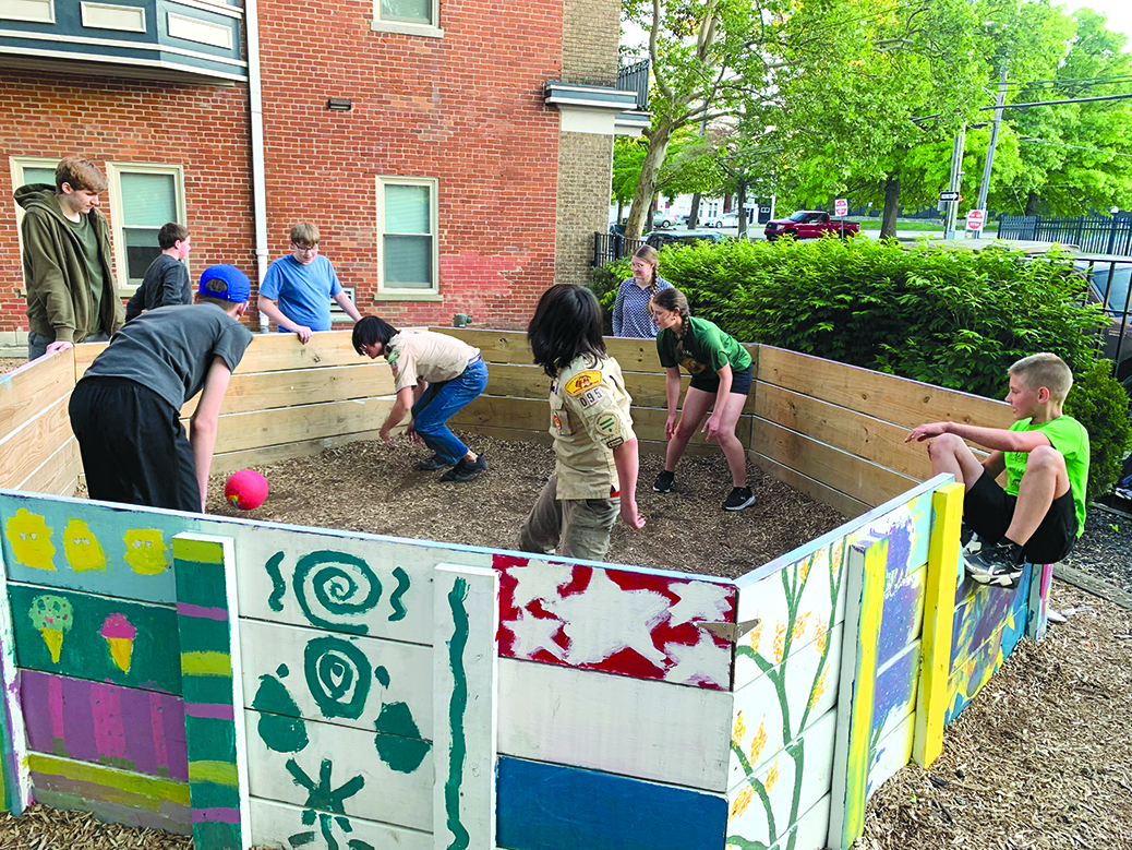 Some of Umbrielle Crawford’s scouting mates and friends give her Gaga ball pit a test drive before it is installed at TBy Nila Harris