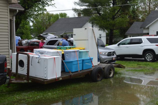 Many homes were filling uip trailers, trucks and animal haulers.