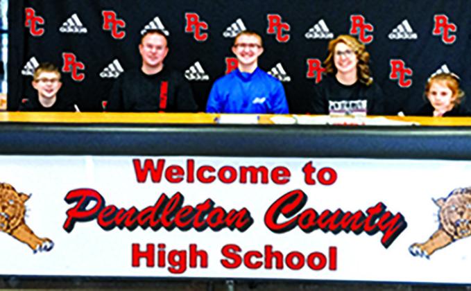 Austin Browning, center, is the first from PHS to sign as an Esports competitor at the college level. He will attend Thomas More University. Browning is pictured with his mother and father, Steve and Stephanie, and his siblings.