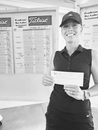 First Flight Champion Kellie House collects her winner's check
