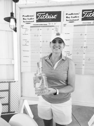 Championship Flight winner Diana Mueller poses with her trophy
