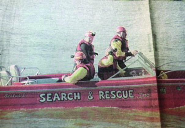 Bill Smallwood, Ron Said, Mike Martin, and Darrin Brown on a search mission in the boat donated by Falmouth, MA.