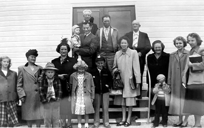 Photo of congregants outside of the new church, circa 1950.
