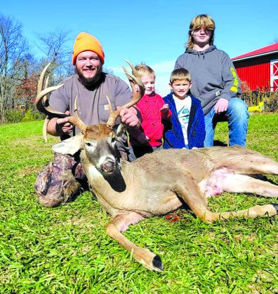  Steven Wright poses with his sons and his deer he got. "I killed the biggest buck of my life," he said.