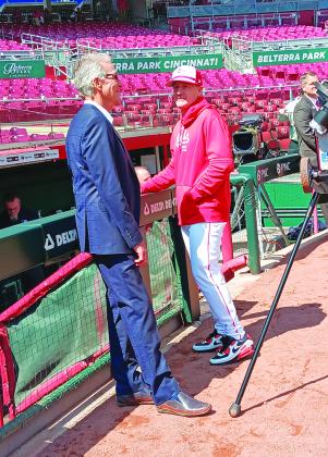 Longtime Reds television and radio broadcaster Chris Welsh, left, chats with David Bell during batting practice.