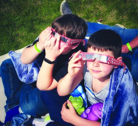 Logan and Ronin MacNeil of Butler were among the crowd that watched the total solar eclipse from outside the Armstrong Air and Space Museum in Wapakoneta. Their mother, Kira MacNeil, took the photo.