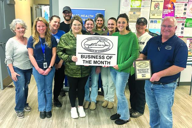 The Pendleton County Chamber of Commerce recognized the Three Rivers District Health Department as its Business of the Month for April. At left is Tami Vater, Pendleton County director of development and tourism. At right is Gary Hicks, Chamber president. Three Rivers staff includes, front row from left, Natasha Trauth, Kailee Workman, Emily Crittendon and Linde Eaton; middle row, Becky Messmer, Korynn Marshall and Abigail Henderson; and back row, Justin Pittman and Tammy Thompson. Projects for Three Rivers