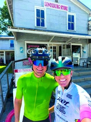 Pendleton County native Natalie Kelsch Stewart and her husband, AJ, take a breather at the Lenoxburg Store during a 100-mile bike ride June 20. The couple are training for the Ironman Lake Placid on July 19 in Lake Placid, New York.