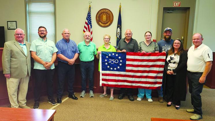 WoodmenLife Chapter 611 in Falmouth on June 9 presented Pendleton County Fiscal Court with a commemorative Betsy Ross America 250 Flag. “WoodmenLife is proud to be part of this historic celebration as we approach America’s 250th anniversary,” local WoodmenLife representative Gary Hicks said. The presentation was part of the not-for-profit insurance company’s nationwide initiative to honor patriotism, unity and the shared history that connects communities across the country. From left are Hicks, Magistrate J