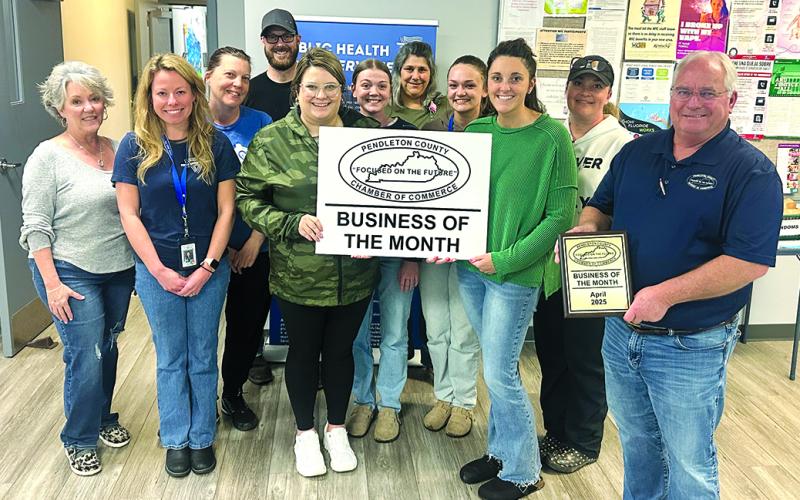 The Pendleton County Chamber of Commerce recognized the Three Rivers District Health Department as its Business of the Month for April. At left is Tami Vater, Pendleton County director of development and tourism. At right is Gary Hicks, Chamber president. Three Rivers staff includes, front row from left, Natasha Trauth, Kailee Workman, Emily Crittendon and Linde Eaton; middle row, Becky Messmer, Korynn Marshall and Abigail Henderson; and back row, Justin Pittman and Tammy Thompson. Projects for Three Rivers