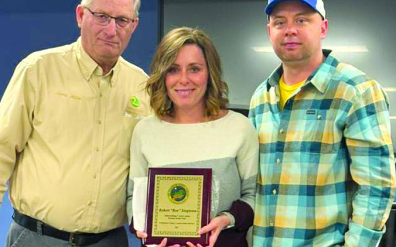 Conservation Person of the Year was awarded posthumously to Robert “Boo” Singleton of Butler. From left are Soil Conservation District representative Larry Miller, and Singleton’s children, Stephanie Singleton Prince and Robert Singleton.