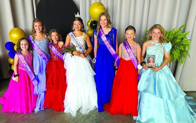 MISS PRETEEN PENDLETON COUNTY: Selected Tuesday night of fair week, the preteen royalty are, from left, Lynlee Whittaker, People’s Choice; Cora Worstell, third runner-up; Ellanore Moore, first runner-up and Miss Personality; Presley Campbell, Miss Preteen Pendleton County 2026; Ellie Wade, second runner-up; Autumn Case, fourth runner-up; and AnnaMae Pugh, Miss Photogenic.