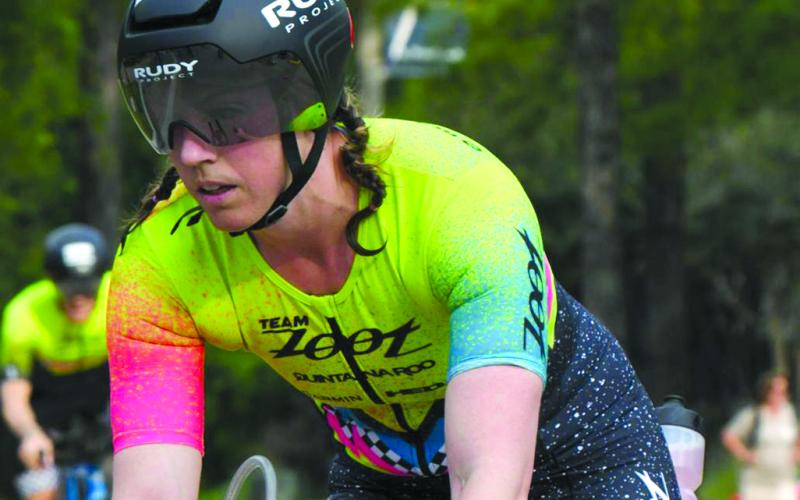 Natalie Stewart pedals through the cycling portion of the Memorial Hermann Ironman Texas on april 27, 2024, in The Woodlands, Texas. She completed that event in 11:42:58
