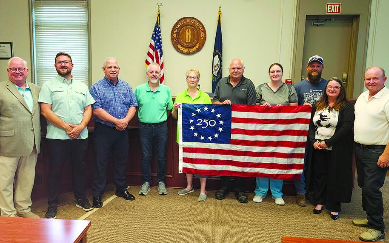 WoodmenLife Chapter 611 in Falmouth on June 9 presented Pendleton County Fiscal Court with a commemorative Betsy Ross America 250 Flag. “WoodmenLife is proud to be part of this historic celebration as we approach America’s 250th anniversary,” local WoodmenLife representative Gary Hicks said. The presentation was part of the not-for-profit insurance company’s nationwide initiative to honor patriotism, unity and the shared history that connects communities across the country. From left are Hicks, Magistrate J