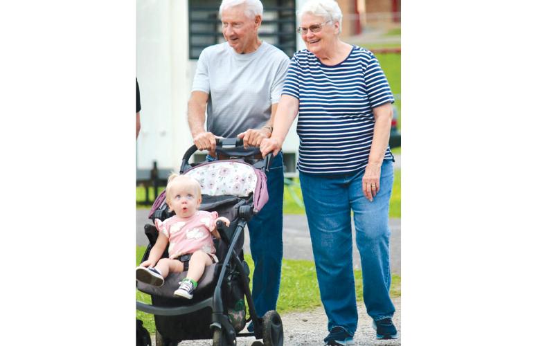 LT and Patty Varner stroll the grounds with a granddaughter who is wowed by the sights.