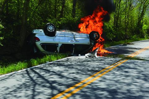 Flames began to consume the white minivan