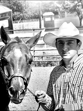 Clay Bowman poses with his beloved horse Charlie.