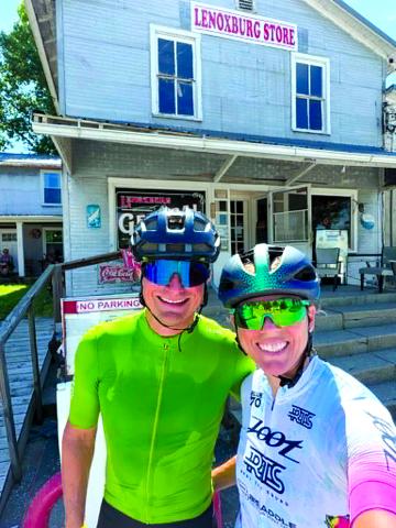 Pendleton County native Natalie Kelsch Stewart and her husband, AJ, take a breather at the Lenoxburg Store during a 100-mile bike ride June 20. The couple are training for the Ironman Lake Placid on July 19 in Lake Placid, New York.