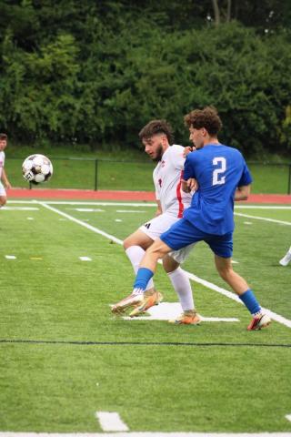 Defender Tristan Mitchell holds off a Scott player during their match on August 15.