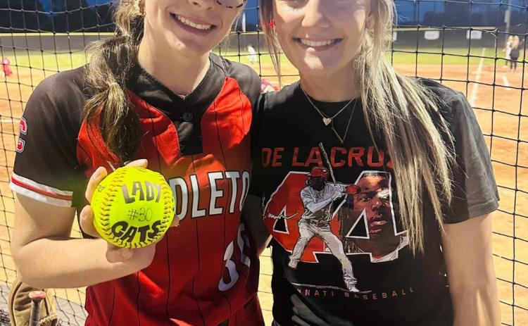 Ladycats ace pitcher Hannah Spaulding, left, poses with her younger sister Hadley after striking out a new career-high 16 hitters versus Woodford County.